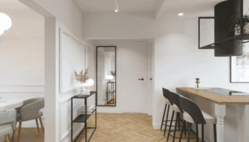 Projekt wnętrz mieszkania w Sieradzu. Akcenty na ścianie e ze sztukaterii. Otwarta kuchnia